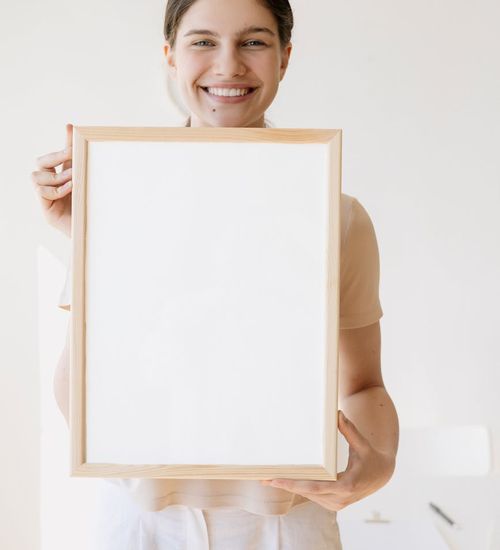 Woman feeling energized and full of life in a bright open space.